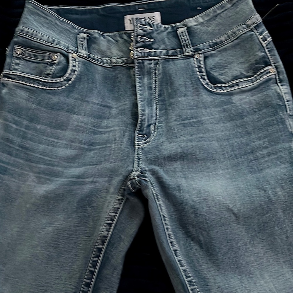 THEY ARE Flare, tight, blue jeans, flower prints on the back with diamonds .